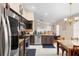 Eat-in kitchen with dark wood cabinets and stainless steel appliances at 3125 Wood Rose Way, Deltona, FL 32725