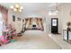 Spacious living room with hardwood floors and large windows at 3125 Wood Rose Way, Deltona, FL 32725