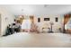 Gathering-friendly living room with a home office space at 3125 Wood Rose Way, Deltona, FL 32725