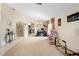 Bright and airy living room with views into the kitchen area at 3125 Wood Rose Way, Deltona, FL 32725