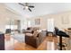 Comfortable living room with hardwood floors and ceiling fan at 3125 Wood Rose Way, Deltona, FL 32725