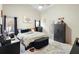 Main bedroom with a king bed, a safe, and private access at 3125 Wood Rose Way, Deltona, FL 32725
