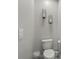 Simple and clean bathroom with toilet and wall decor at 37 Bella Lago Cir, Port Orange, FL 32129