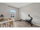Bedroom with crib, rowing machine, and large window at 37 Bella Lago Cir, Port Orange, FL 32129