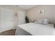 Bright bedroom with a queen bed, plant, and built-in closet at 37 Bella Lago Cir, Port Orange, FL 32129