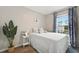 Bedroom with full bed and window with natural light at 37 Bella Lago Cir, Port Orange, FL 32129