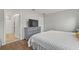 King-size bed in a bright bedroom with en-suite bathroom access at 37 Bella Lago Cir, Port Orange, FL 32129