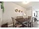 Dining room with dark wood table and six light brown chairs at 37 Bella Lago Cir, Port Orange, FL 32129