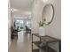Bright and airy entryway with tile flooring and a modern console table at 37 Bella Lago Cir, Port Orange, FL 32129