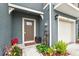 Townhouse exterior with front door and garage at 37 Bella Lago Cir, Port Orange, FL 32129