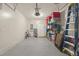 Garage with storage shelving, ladder, and bicycle at 37 Bella Lago Cir, Port Orange, FL 32129