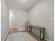 Bright hallway with wood flooring, stylish console table, and area rug at 37 Bella Lago Cir, Port Orange, FL 32129