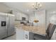 Modern kitchen with granite island and stainless steel appliances at 37 Bella Lago Cir, Port Orange, FL 32129