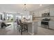 Modern kitchen featuring granite countertops and stainless steel appliances at 37 Bella Lago Cir, Port Orange, FL 32129