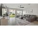 Spacious living room with a sectional sofa and sliding doors to backyard at 37 Bella Lago Cir, Port Orange, FL 32129