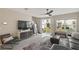 Living room with sectional sofa, sliding glass doors and backyard access at 37 Bella Lago Cir, Port Orange, FL 32129