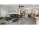Open concept living room with leather sectional and view of kitchen at 37 Bella Lago Cir, Port Orange, FL 32129