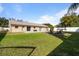 Backyard with firepit, patio, and trampoline at 373 Blythville Ave, Deltona, FL 32725