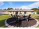 Firepit and seating area in backyard at 373 Blythville Ave, Deltona, FL 32725