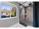 Modern bathroom with a large walk-in shower and herringbone tile floor at 373 Blythville Ave, Deltona, FL 32725