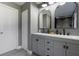 Stylish bathroom with dual vanities and an arched mirror at 373 Blythville Ave, Deltona, FL 32725