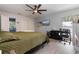 Second bedroom with a king-size bed and an office area at 373 Blythville Ave, Deltona, FL 32725