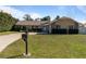 House exterior with landscaping and driveway at 373 Blythville Ave, Deltona, FL 32725