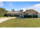 Single-story home with landscaped yard and driveway at 373 Blythville Ave, Deltona, FL 32725