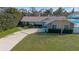 House exterior, landscaped yard, and driveway at 373 Blythville Ave, Deltona, FL 32725