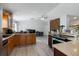 Spacious kitchen with wood cabinets and modern appliances at 373 Blythville Ave, Deltona, FL 32725