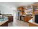 Bright kitchen featuring stainless steel appliances and wood cabinets at 373 Blythville Ave, Deltona, FL 32725