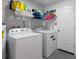 Convenient laundry room with washer, dryer, and ample storage at 373 Blythville Ave, Deltona, FL 32725