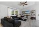 Living room with large sectional sofa and built-in shelving at 373 Blythville Ave, Deltona, FL 32725