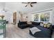 Spacious living area with a large sectional sofa and stone fireplace at 373 Blythville Ave, Deltona, FL 32725