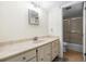 Updated bathroom with light vanity and shower at 3800 S Atlantic Ave # 5040, Daytona Beach, FL 32118