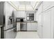 White kitchen cabinets and stainless steel appliances at 3800 S Atlantic Ave # 5040, Daytona Beach, FL 32118