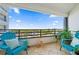 Private balcony with ocean views and comfortable seating at 395 S Atlantic Ave # 301, Ormond Beach, FL 32176