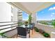 Private balcony with outdoor furniture and scenic view at 395 S Atlantic Ave # 301, Ormond Beach, FL 32176