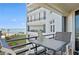 Balcony with ocean view and small table at 395 S Atlantic Ave # 301, Ormond Beach, FL 32176