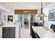 Bright dining area with tile table and access to balcony at 395 S Atlantic Ave # 301, Ormond Beach, FL 32176