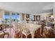 Formal dining room features large table and access to balcony at 395 S Atlantic Ave # 301, Ormond Beach, FL 32176