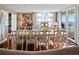 Elegant dining room with white table and chairs, and ocean view at 395 S Atlantic Ave # 301, Ormond Beach, FL 32176