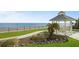 White gazebo near the ocean with manicured lawn at 395 S Atlantic Ave # 301, Ormond Beach, FL 32176