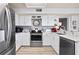 Modern kitchen with white cabinets and stainless steel appliances at 395 S Atlantic Ave # 301, Ormond Beach, FL 32176