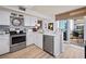 Modern kitchen features stainless steel appliances and white cabinetry at 395 S Atlantic Ave # 301, Ormond Beach, FL 32176
