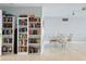 Community library with book shelves and a small table with chairs at 395 S Atlantic Ave # 301, Ormond Beach, FL 32176