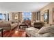 Living room boasts hardwood floors, ample seating, and ocean view at 395 S Atlantic Ave # 301, Ormond Beach, FL 32176