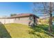 View of the house's backyard, showing a large grassy area at 462 Tuscany Chase Dr, Daytona Beach, FL 32117
