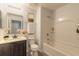 Clean bathroom with a bathtub, shower, and dark brown vanity at 462 Tuscany Chase Dr, Daytona Beach, FL 32117