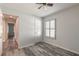 Spacious bedroom with wood-look flooring and access to another room at 462 Tuscany Chase Dr, Daytona Beach, FL 32117